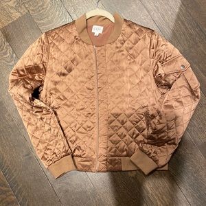 Cami brand, Sleek, champagne colored light-weight bomber